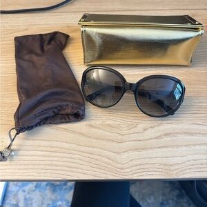 Elegant Black Sunglasses with Gold Case